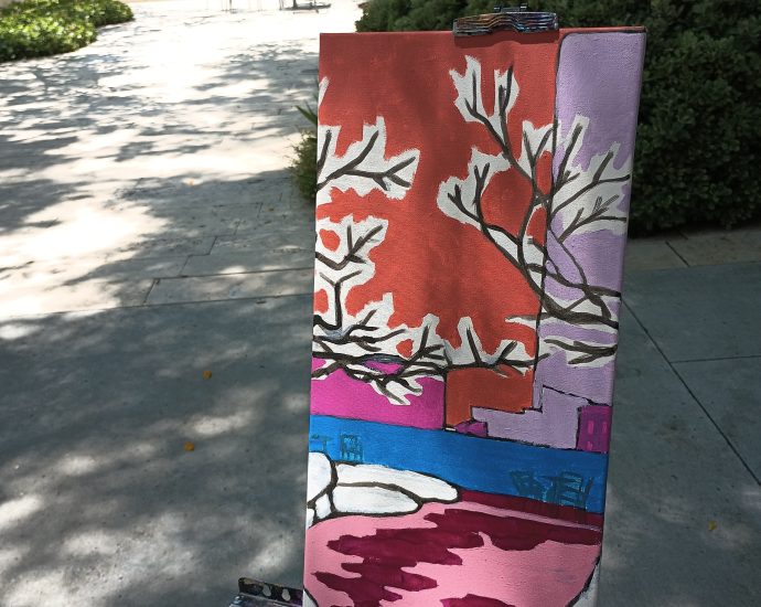 painting on an easel in the shade with painting equipment by Oscar Will